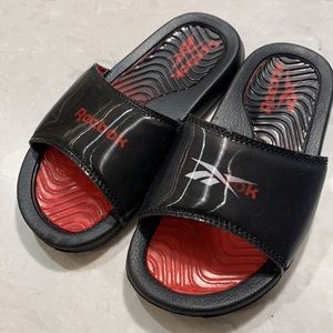 Black/Red Reebok slide sandals, size 1